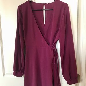 Burgundy colored long sleeve wrap dress